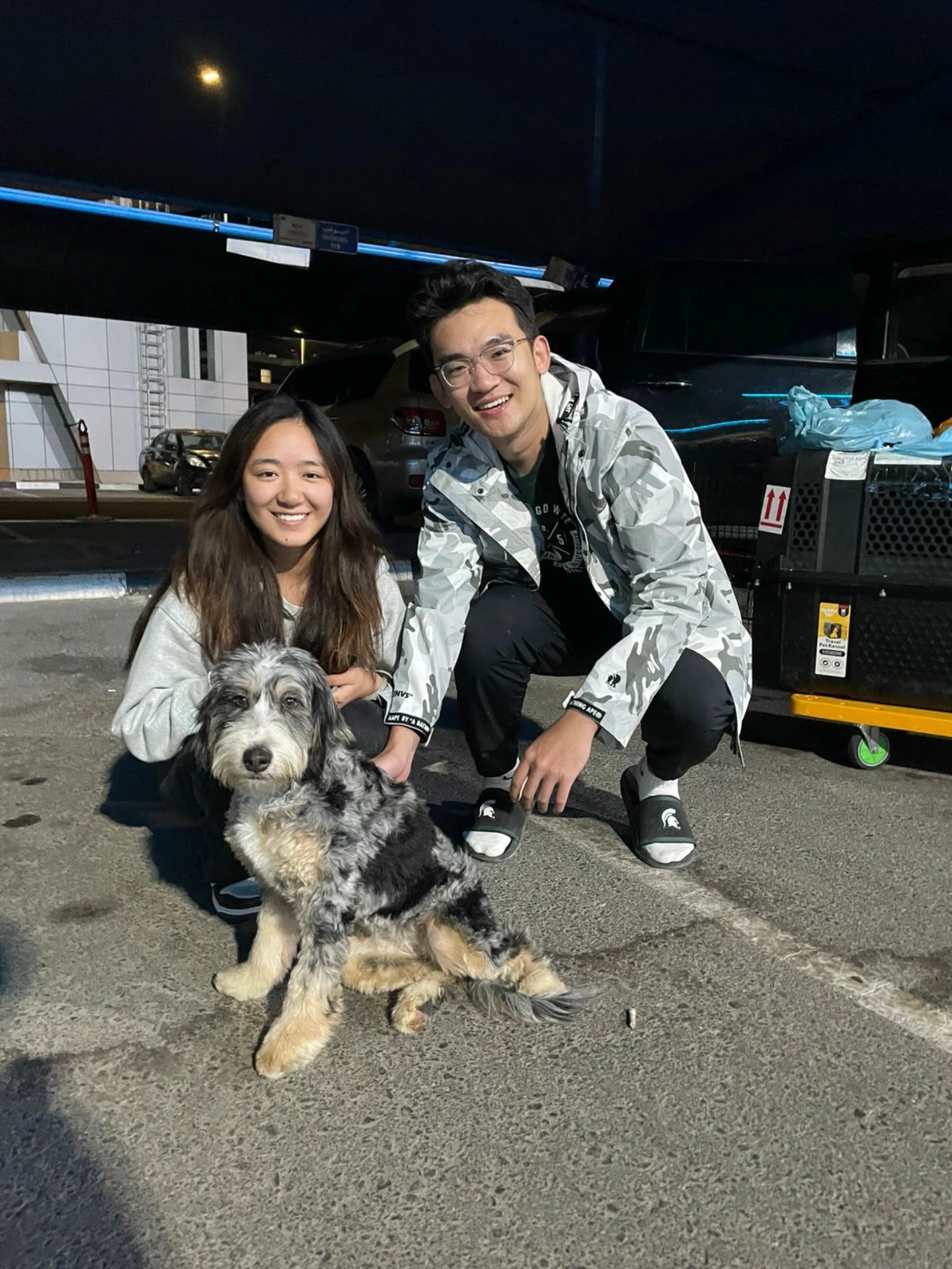 Happy owners in Dubai picking up puppy