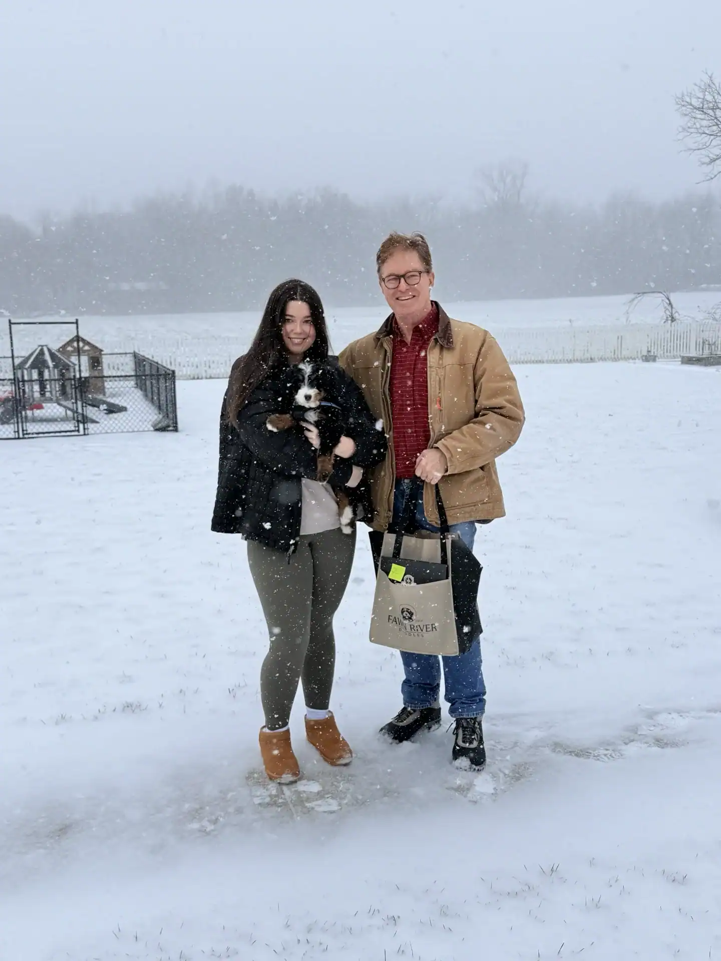 Bernedoodle going home with his new parents