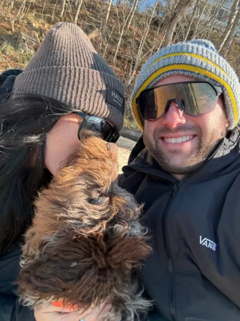Stopping to take a selfie while on a walk with there Bernedoodle