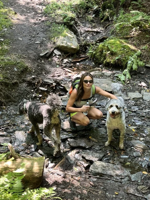 Customer enjoys hiking and running with her dog.