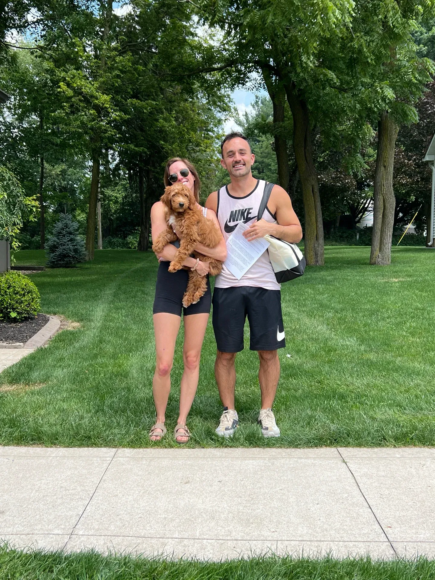 Happy family picking up their first family addition