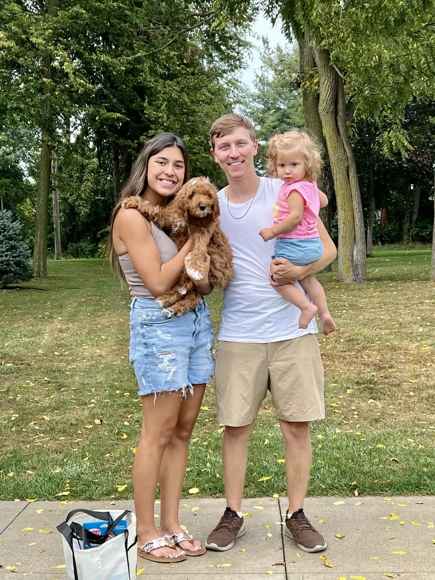 Goldendoodle going home with her new family.