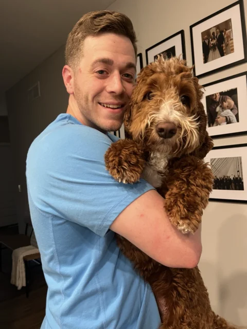 A happy owner holding his best friend