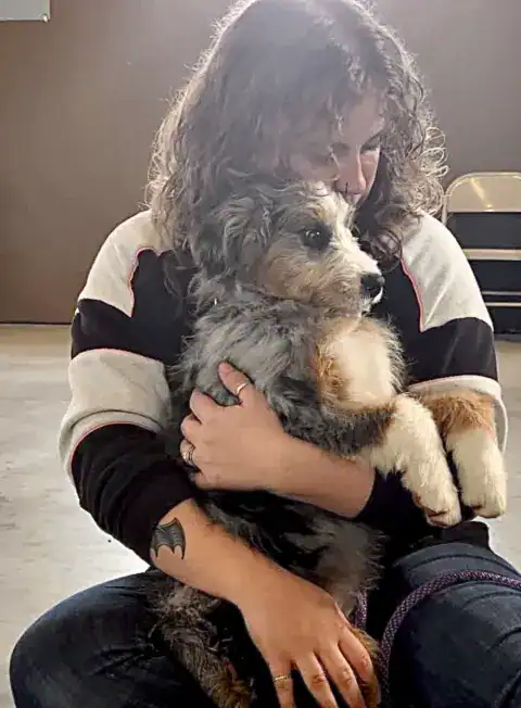 Trainer showing some love after a dog did a good job